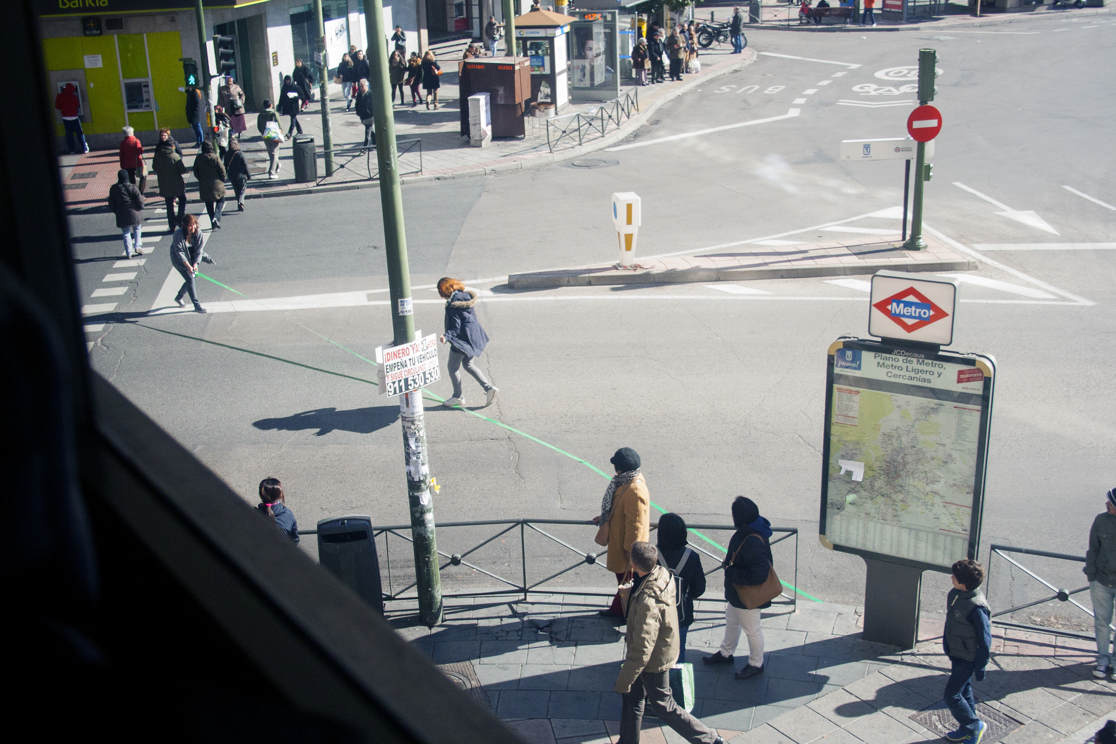Person crossing a road while creating a green line