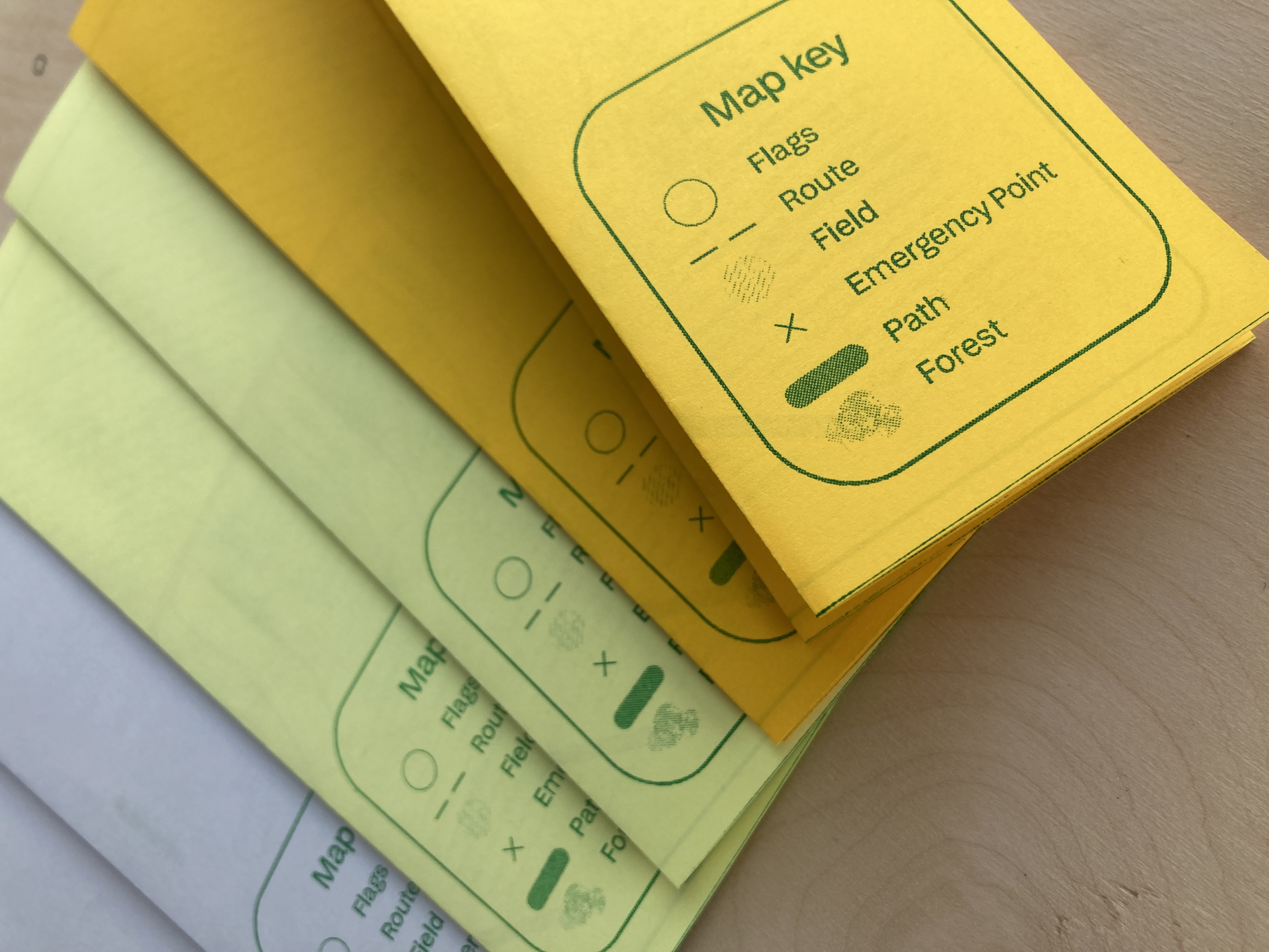 Folded map with green typeface