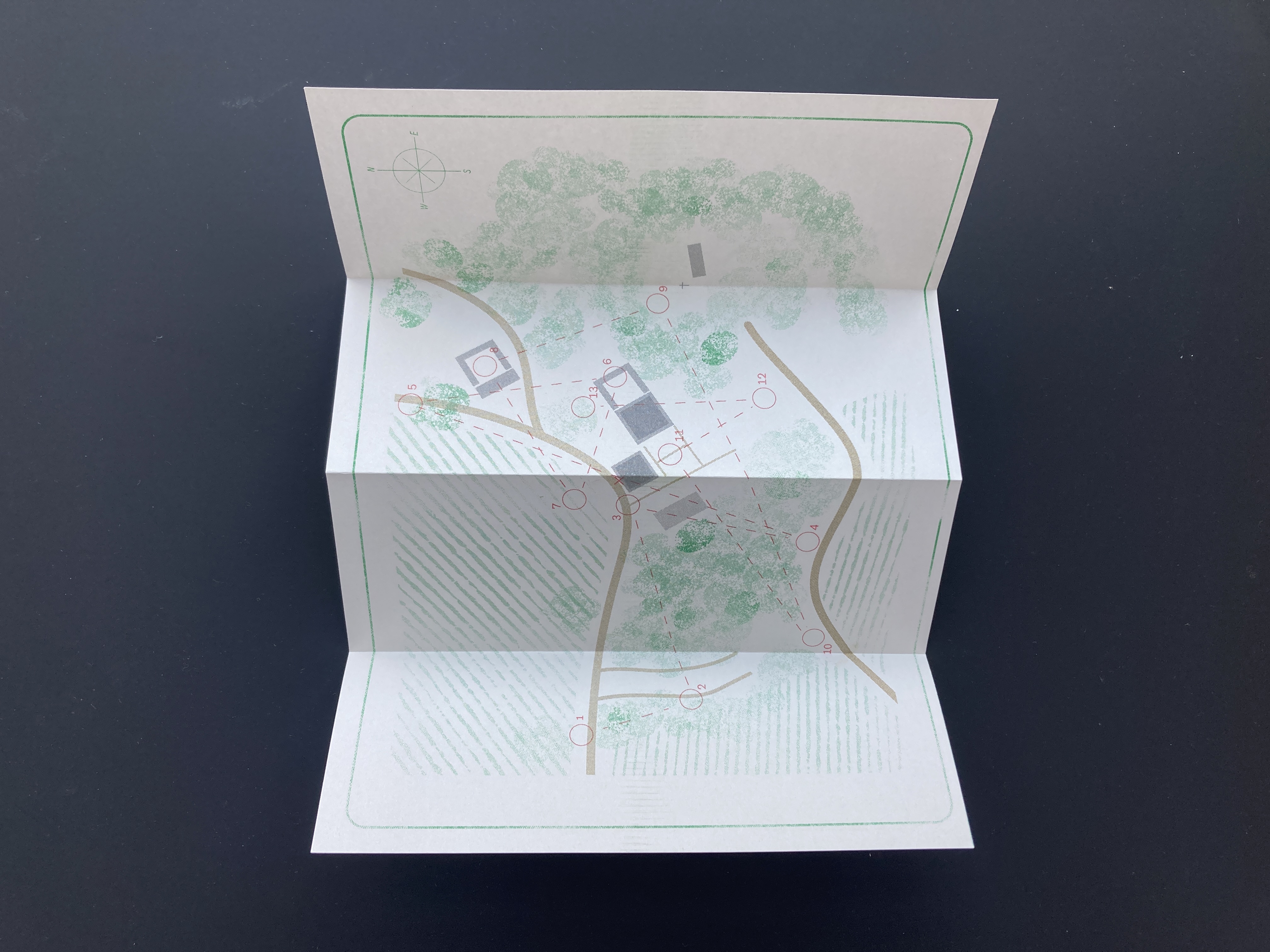 Folded map with green typeface