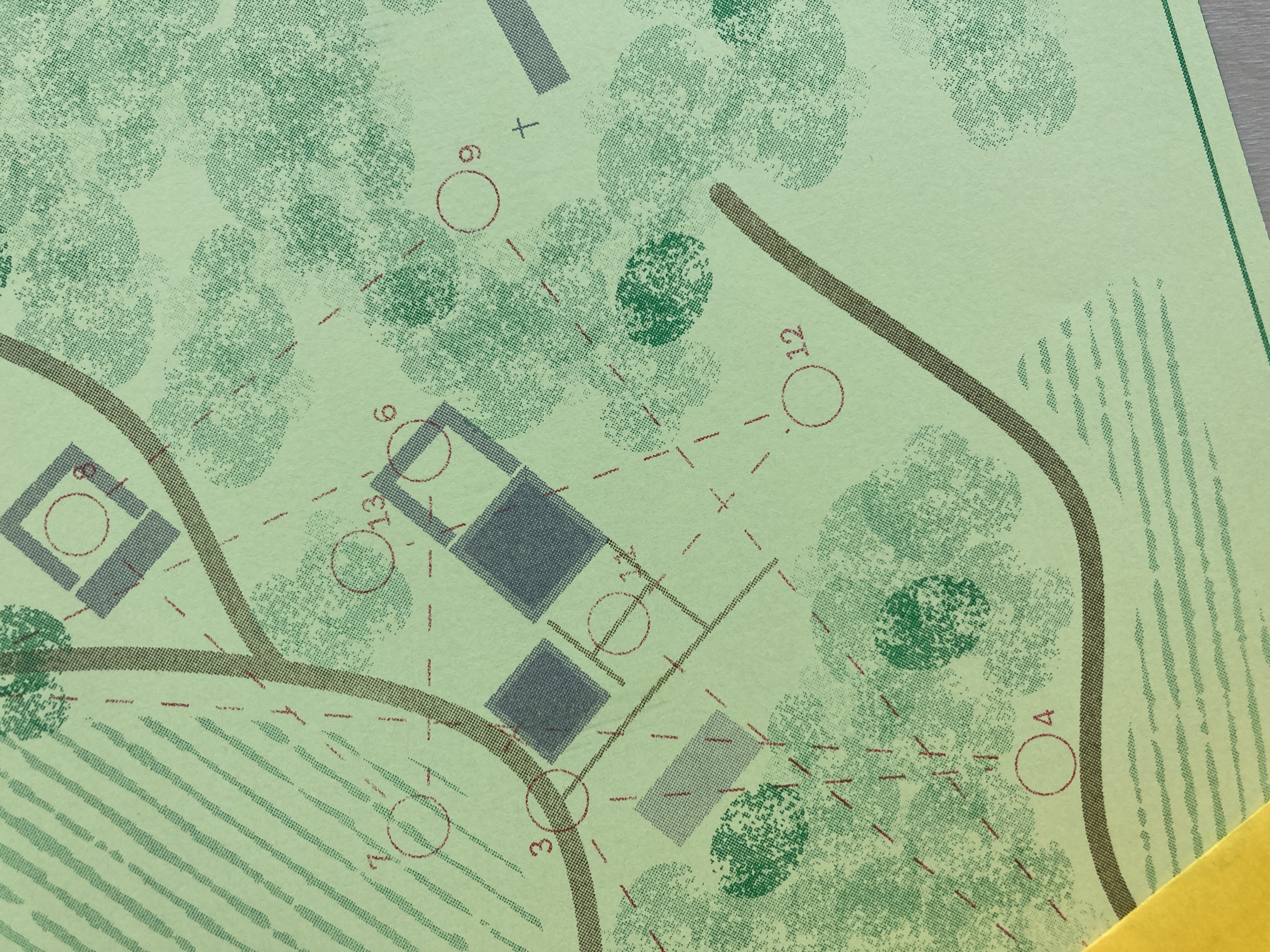 Folded map with green typeface