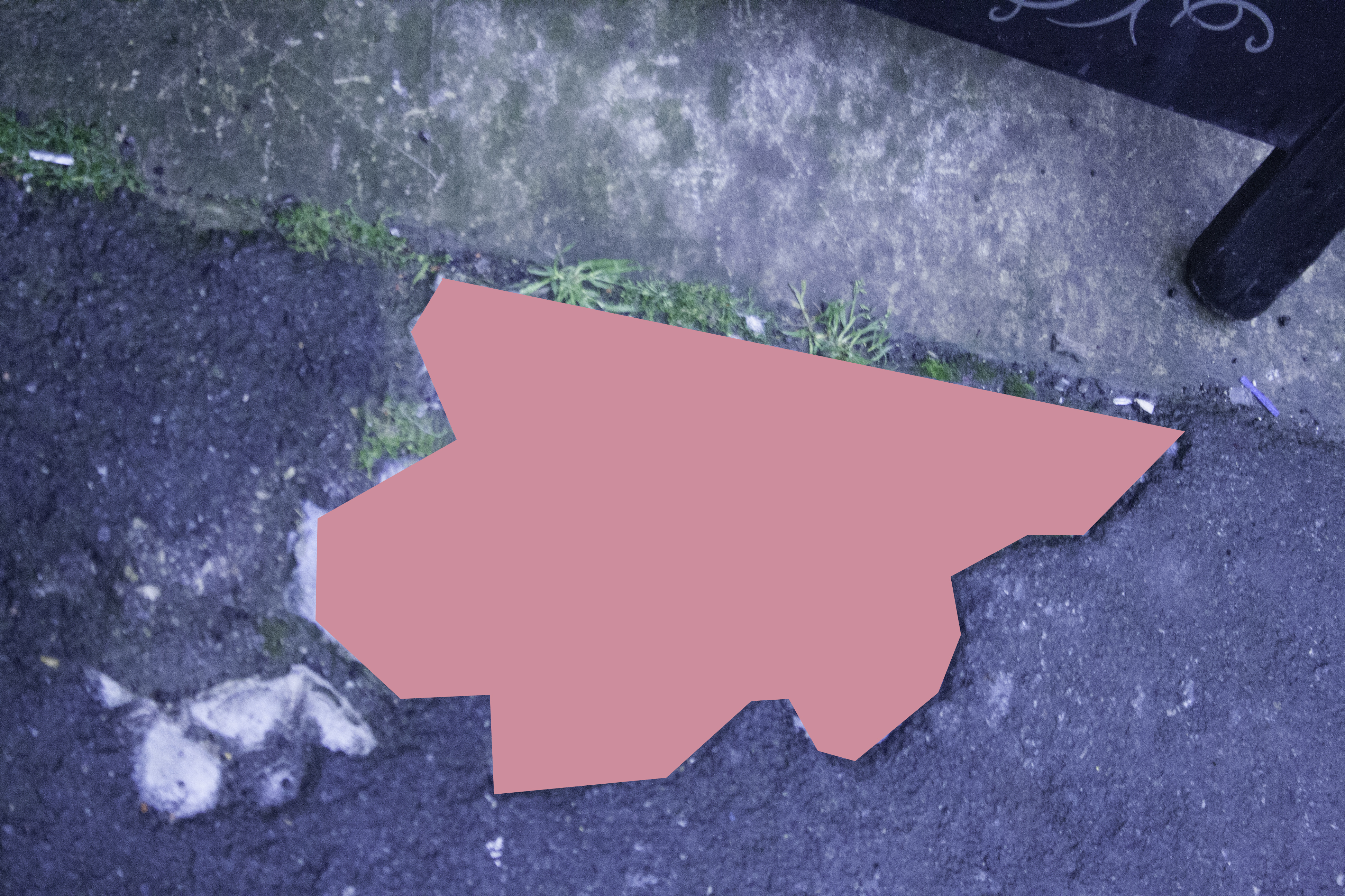 Pink shape on a pavement floor